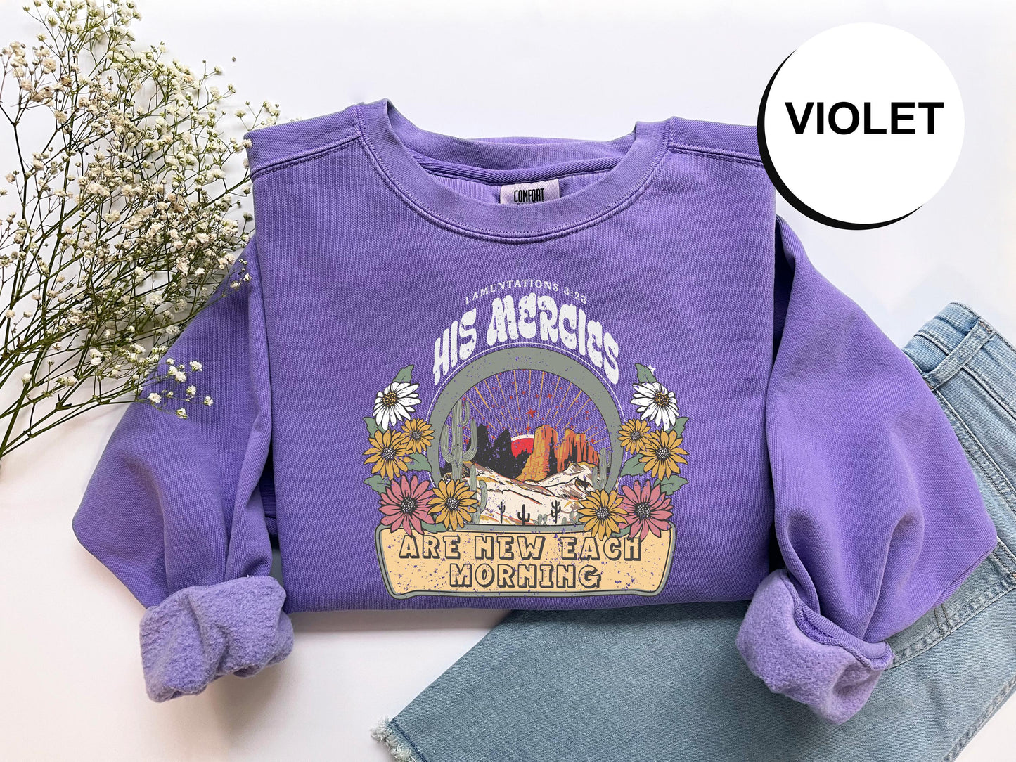 a purple shirt with a picture of two cats on it
