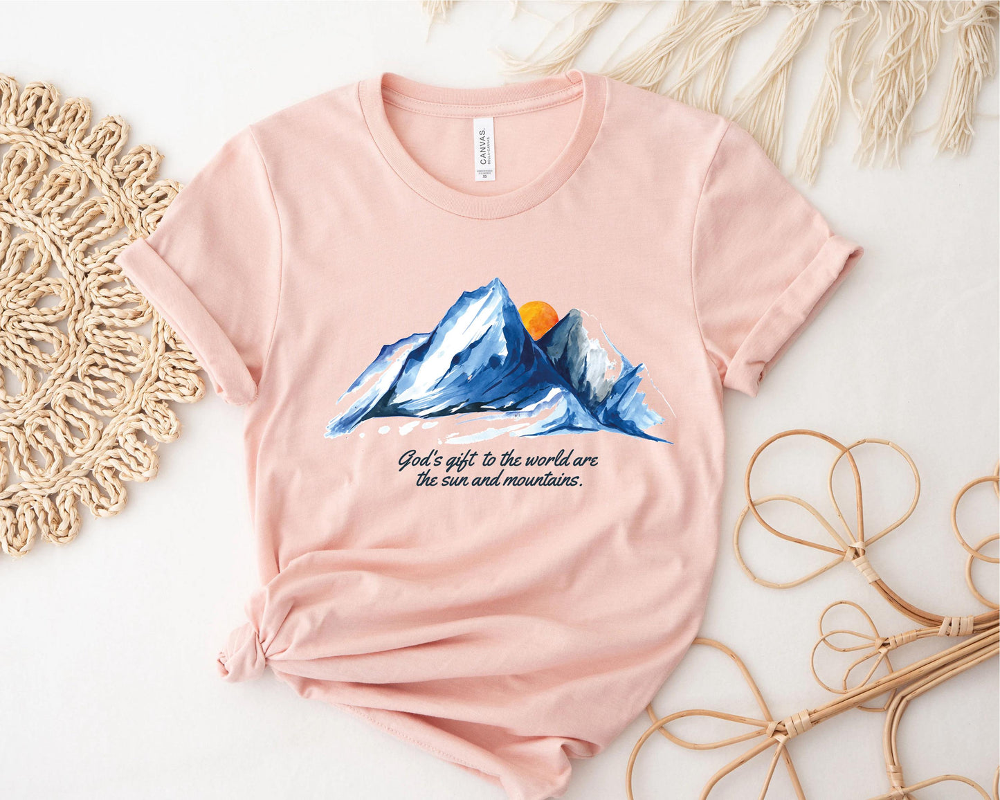 a t - shirt with a picture of a mountain on it