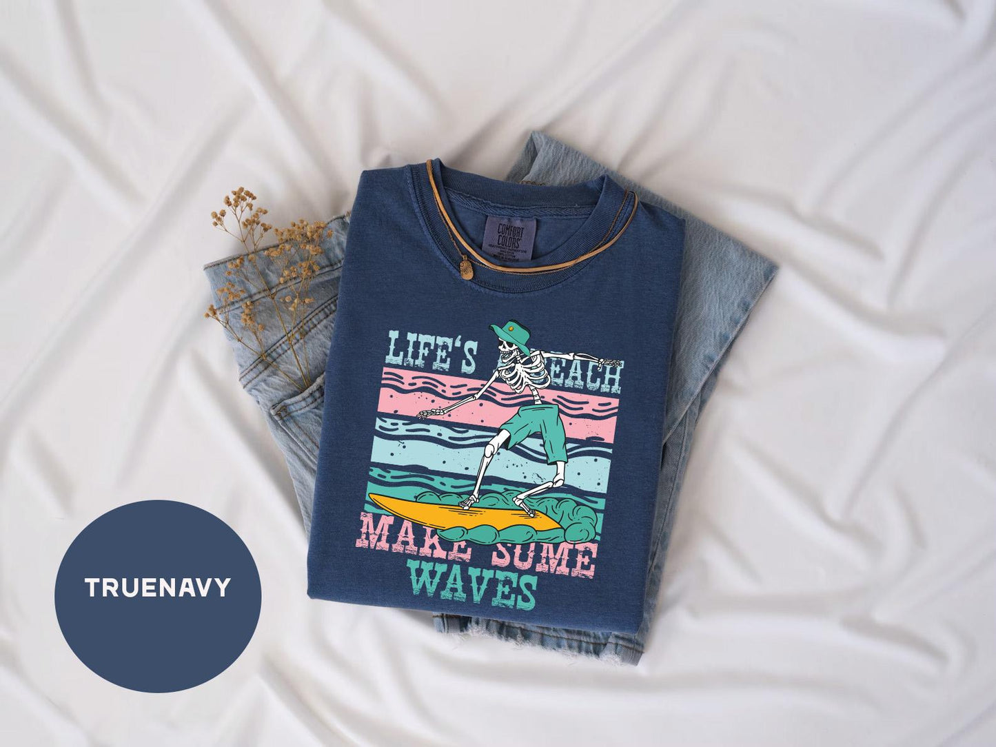 a t - shirt that says life's tough make some waves