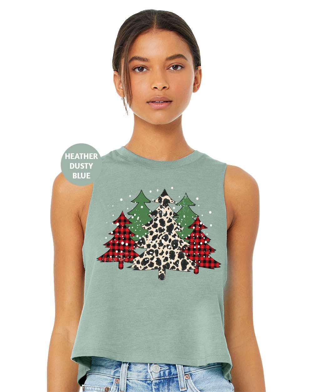 a woman wearing a tank top with a christmas tree on it