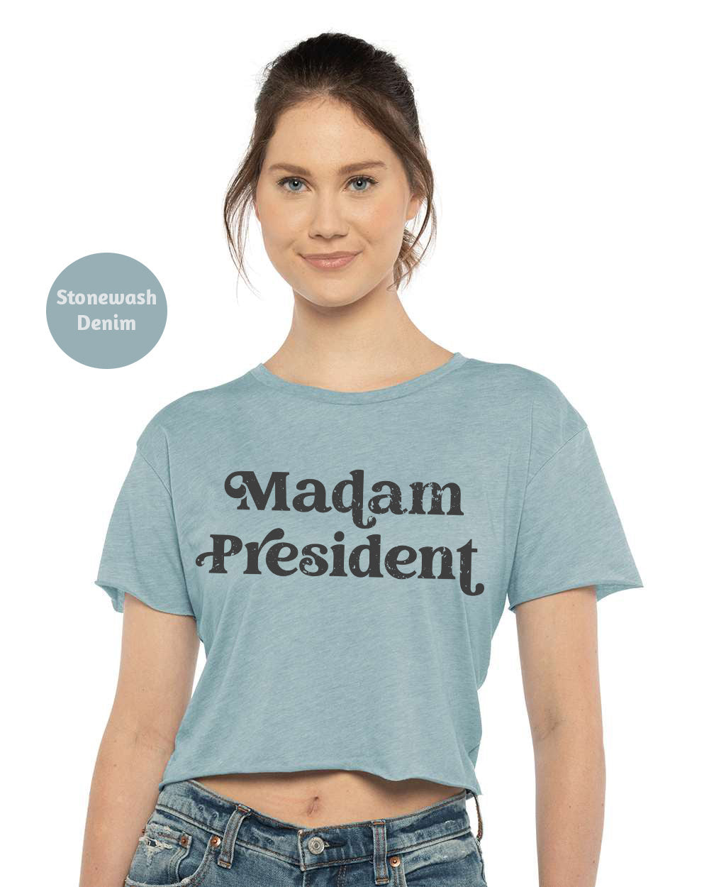 a woman wearing a crop top that says madam president