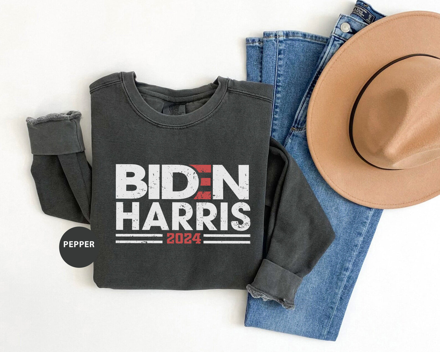 a black shirt with bidn harris on it next to a cowboy hat