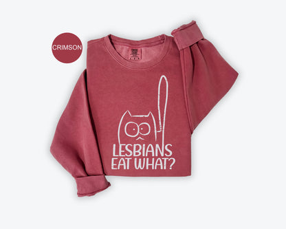 a red shirt with the words lesbians eat what? on it