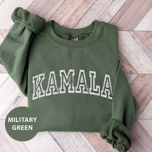 a green sweatshirt with the word kalamala printed on it