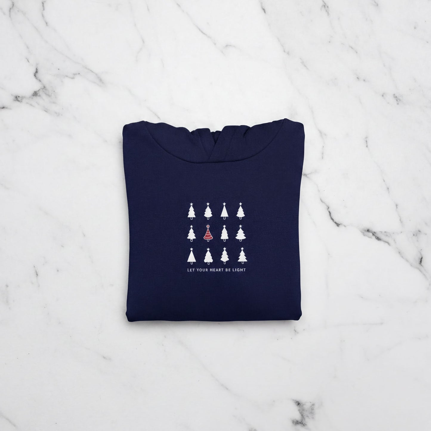 A navy blue hoodie with a white graphic design on the front, featuring a row of white Christmas trees with a single red tree in the center.