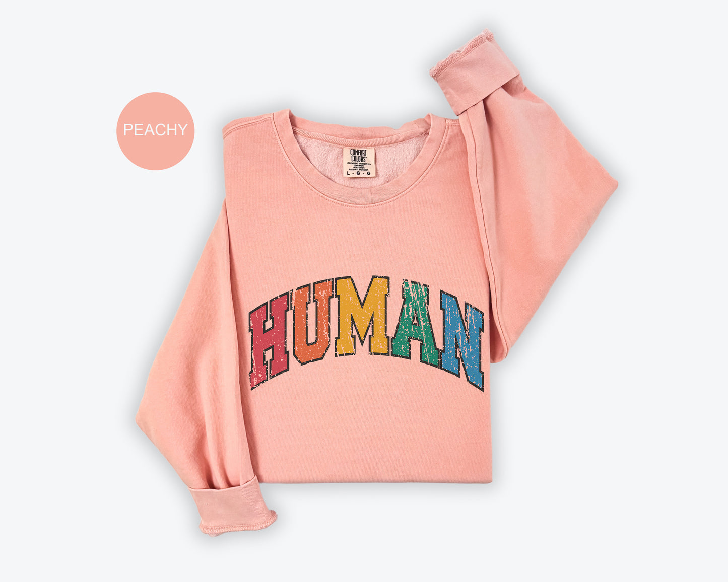 a pink shirt with the word human printed on it