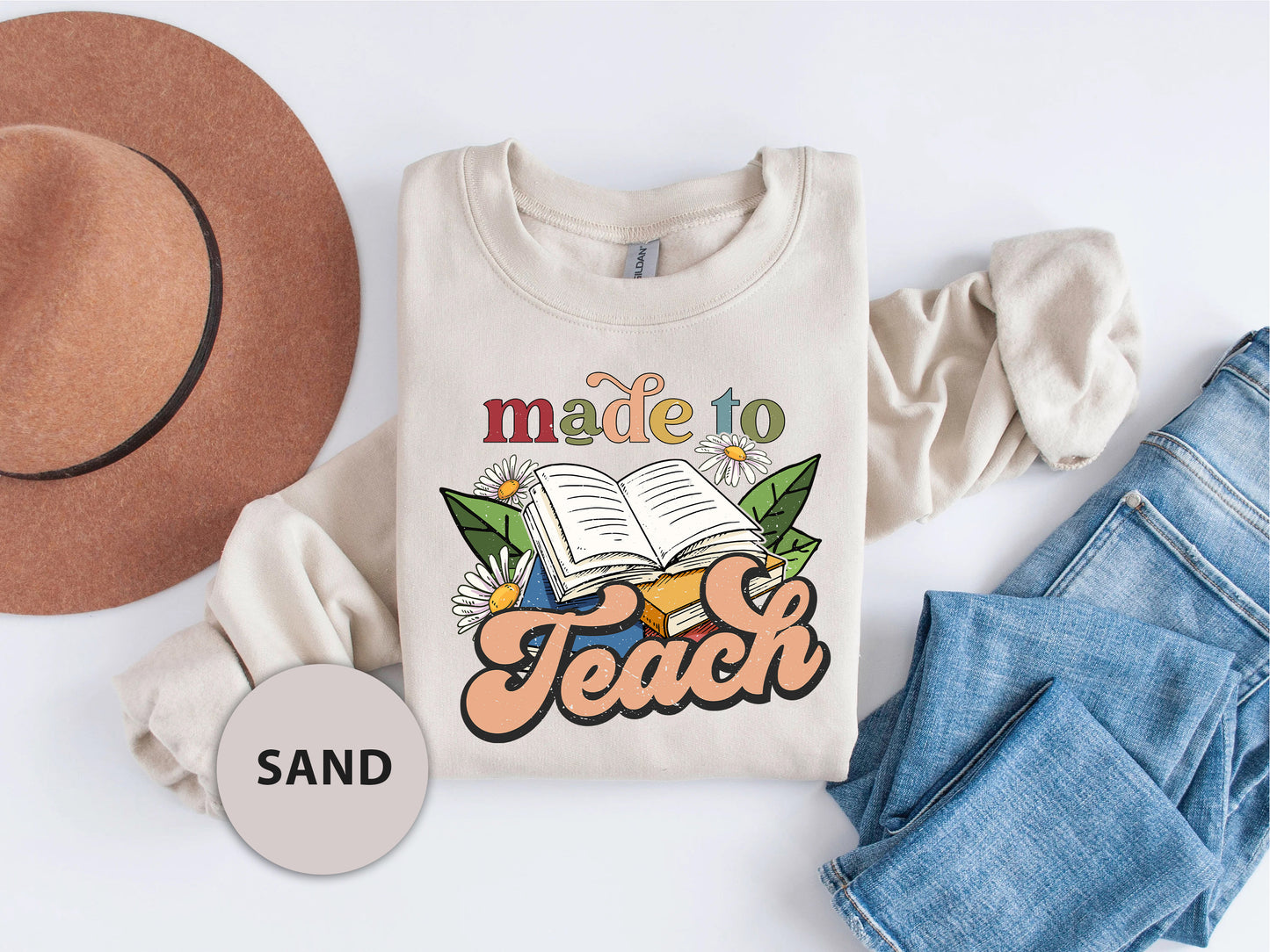 a t - shirt that says made to teach next to a hat and jeans