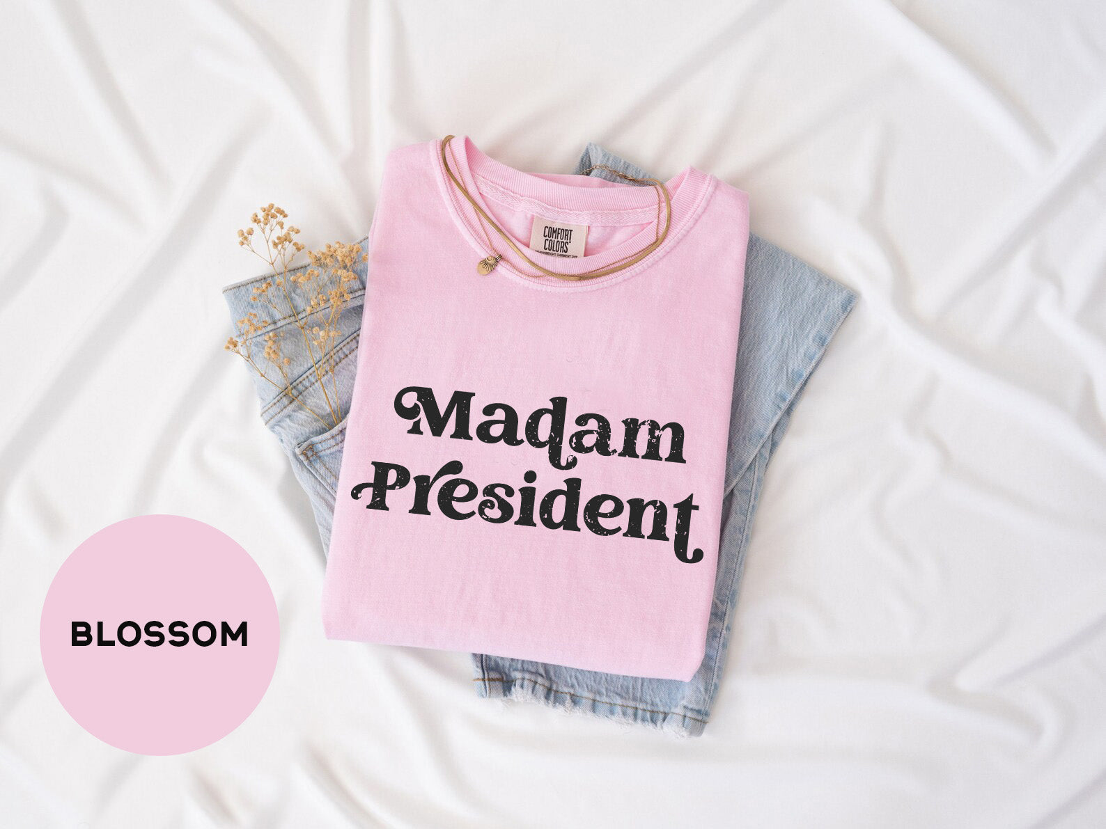 a pink shirt that says madam president on it