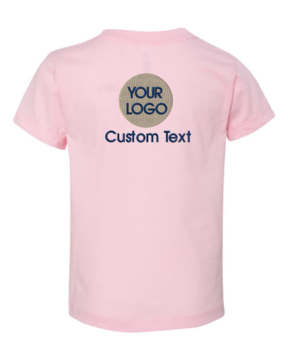 a pink t - shirt with a circular logo on the chest