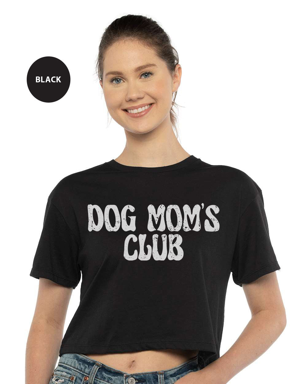 a woman wearing a black dog mom's club crop top