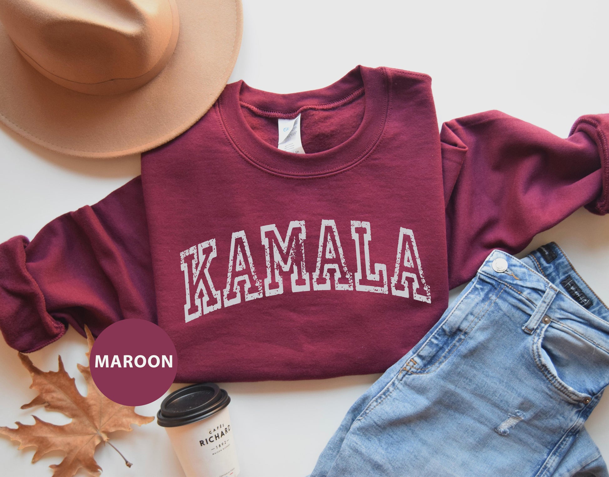 a maroon sweatshirt with the word kaamala printed on it