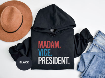 a black hoodie with the words madam vice president on it