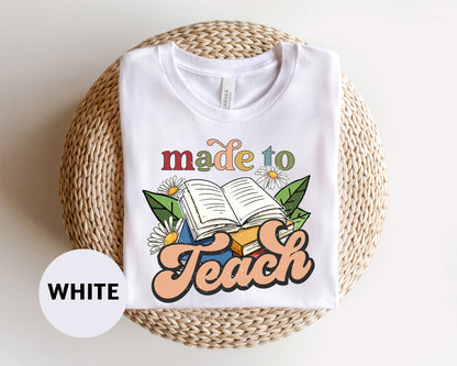 a white t - shirt with the words made to teach printed on it