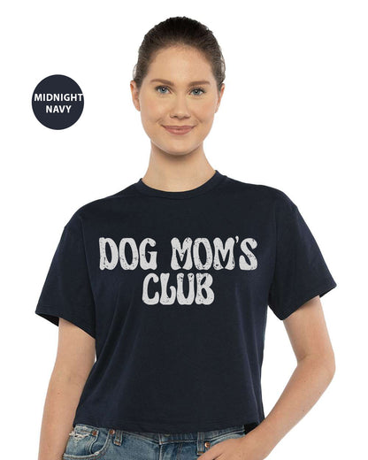 a woman wearing a dog mom's club t - shirt