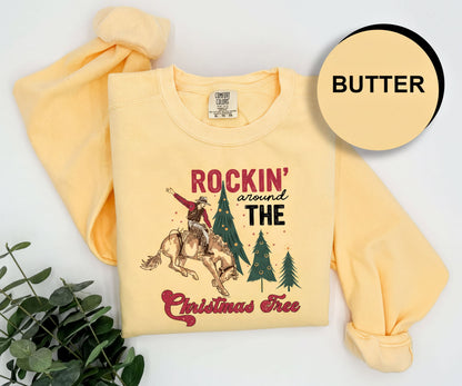 A yellow t-shirt with a graphic design and text, along with a plant and a circular logo with the word "BUTTER" on it.