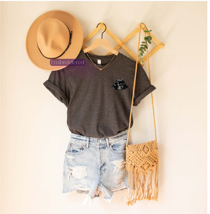 a t - shirt, shorts, and hat are hanging on a wall