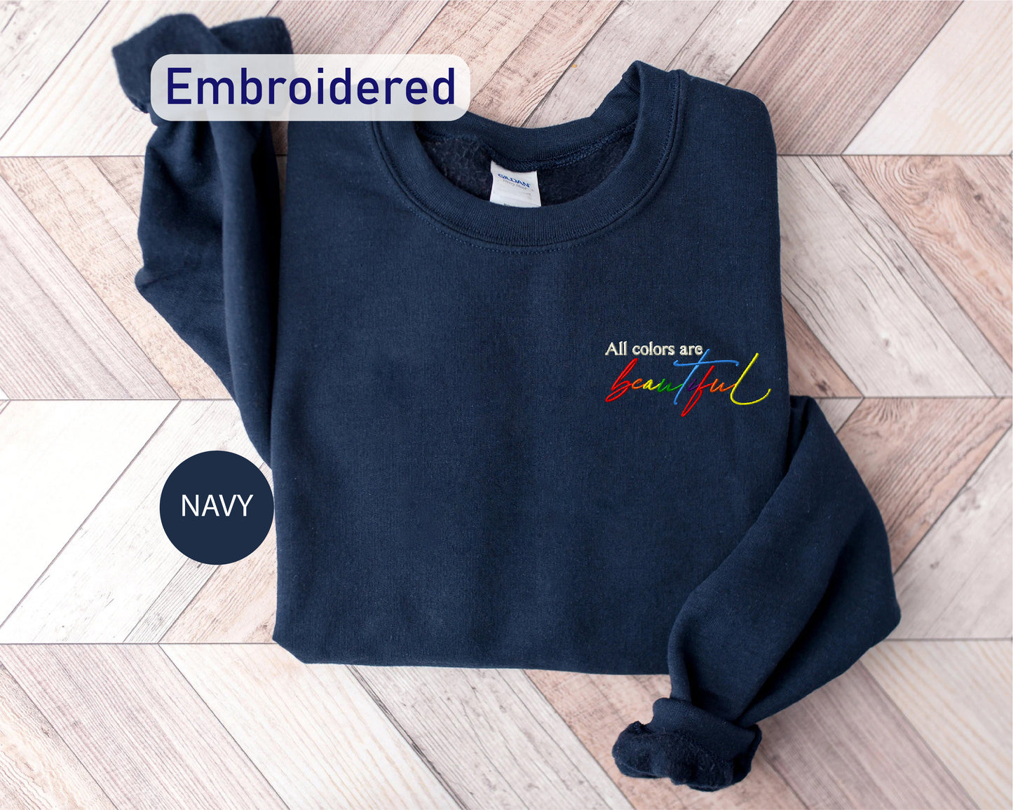 a navy colored sweatshirt with the words embroidered on it