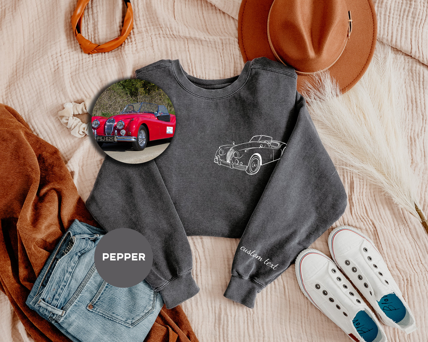 a sweater with a picture of a car on it