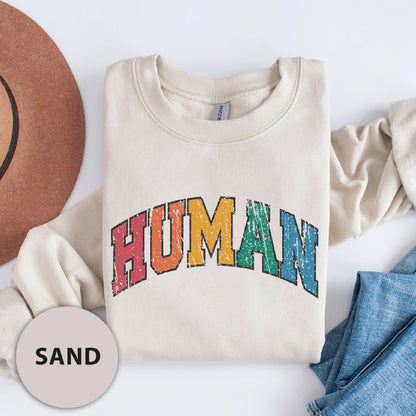 a white shirt with the word human printed on it