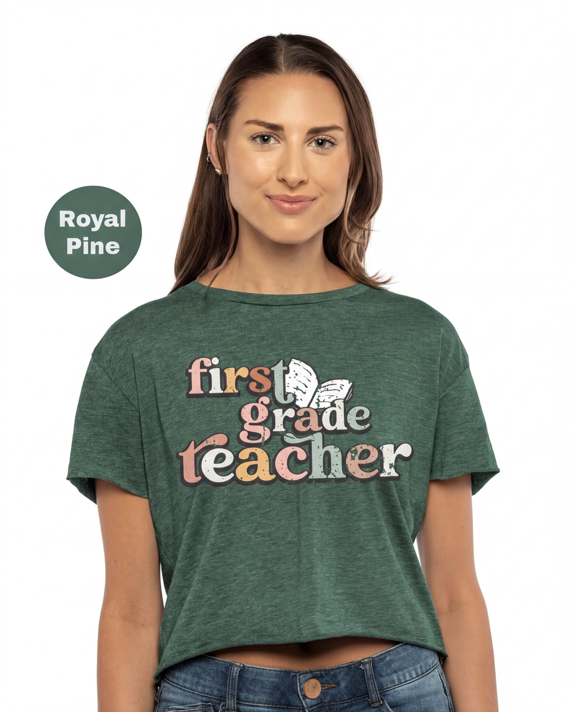 A woman wearing a green t-shirt with the text "first grade teacher" printed on it.