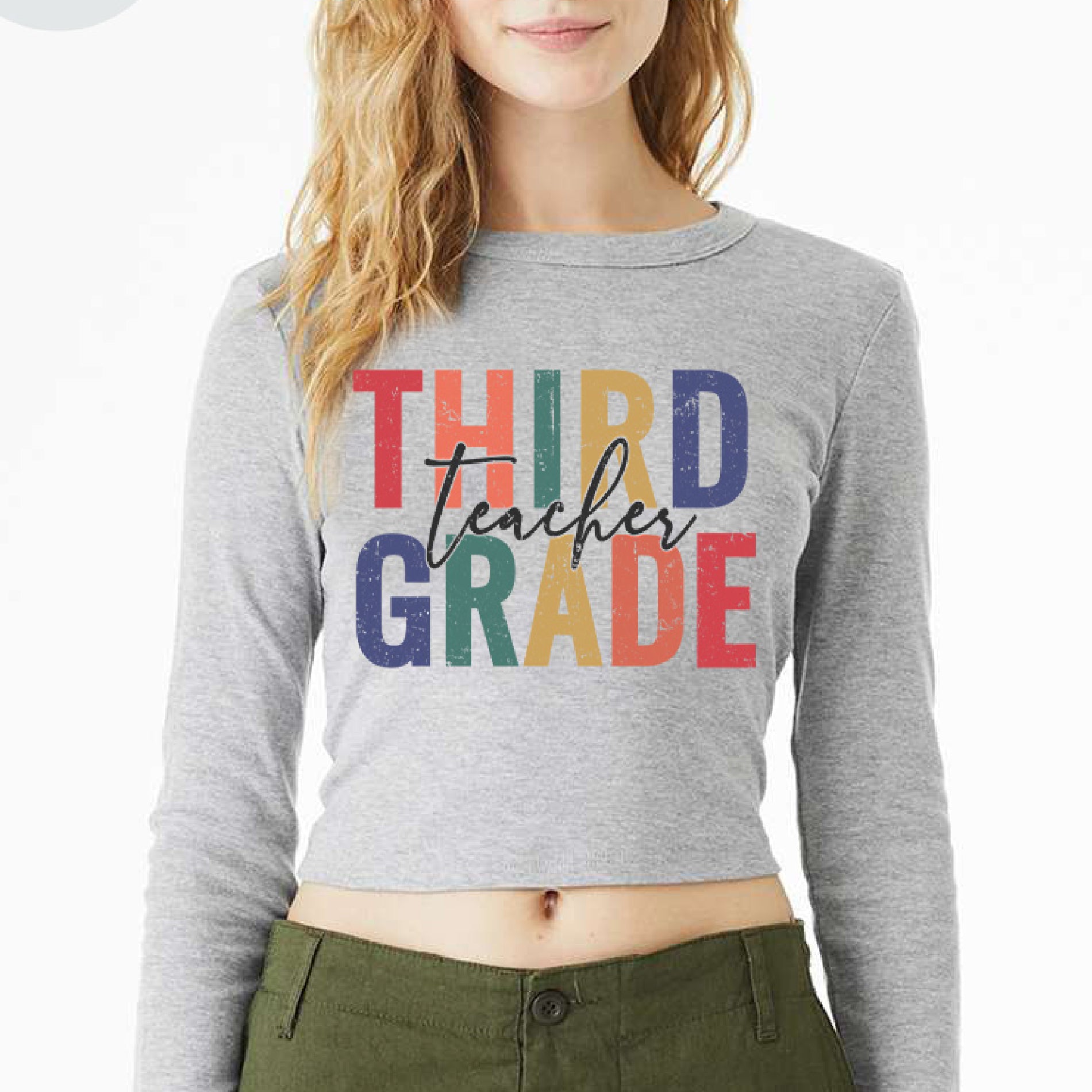 a woman wearing a crop top that says third grade