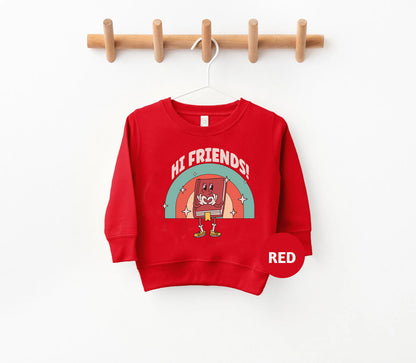 a red sweatshirt hanging on a wooden hanger