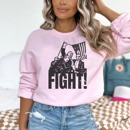 a woman wearing a pink sweatshirt that says fight