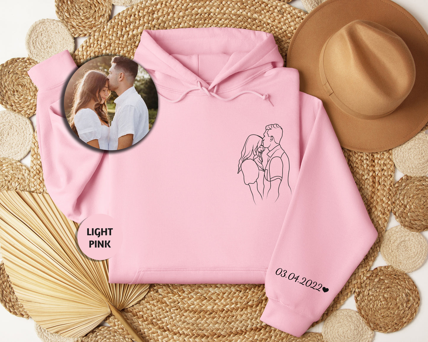 a pink hoodie with a picture of a couple on it