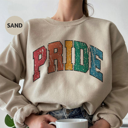 a woman wearing a sweatshirt with the word pride printed on it