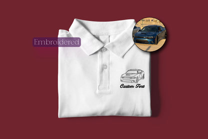 a white polo shirt with a picture of a car on it