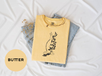 a t - shirt that says butter on it next to a pair of jeans