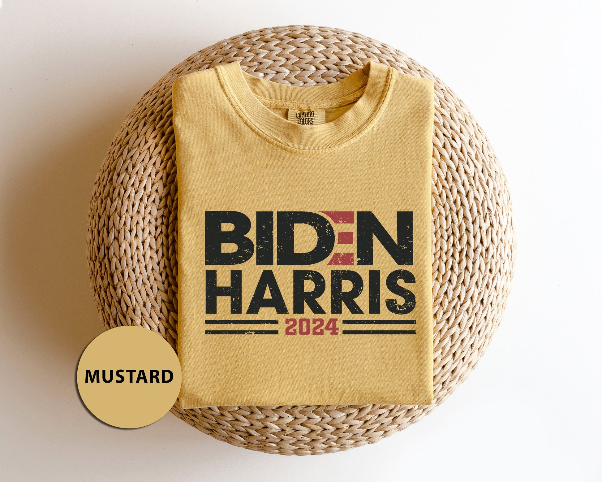 a yellow shirt with bidn harris on it next to a wicker