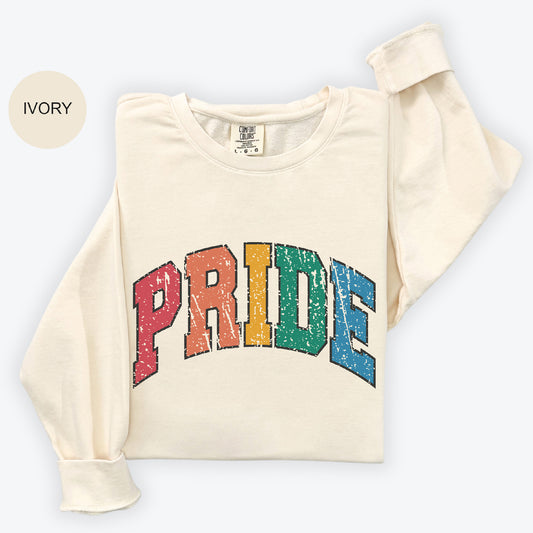 a white shirt with the word pride painted on it