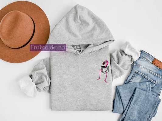 a gray hoodie with a pink flamingo embroidered on it