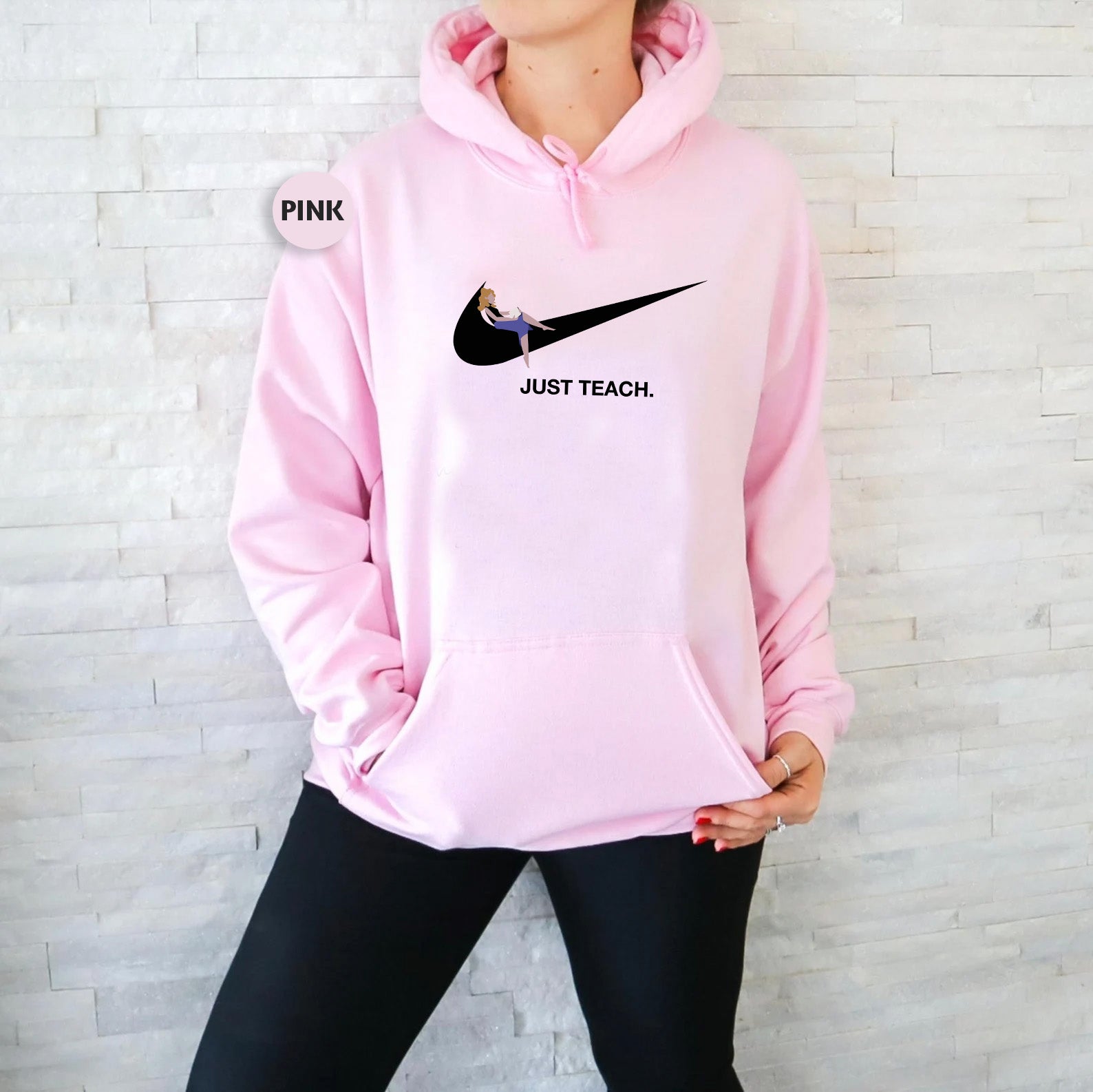 a woman wearing a pink nike hoodie