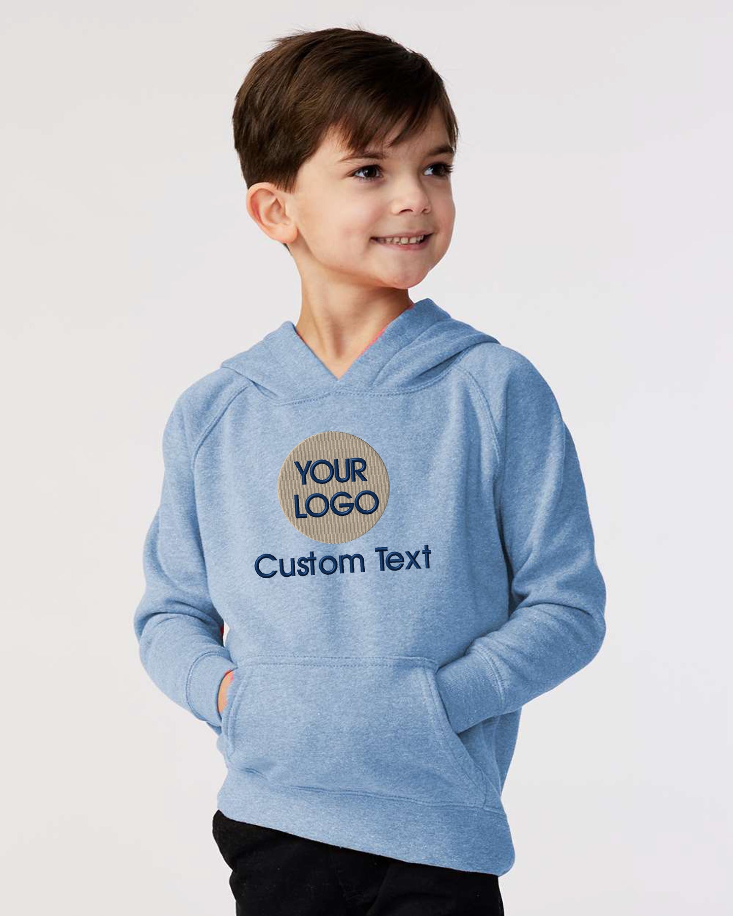 a young boy wearing a blue hoodie with a logo on it