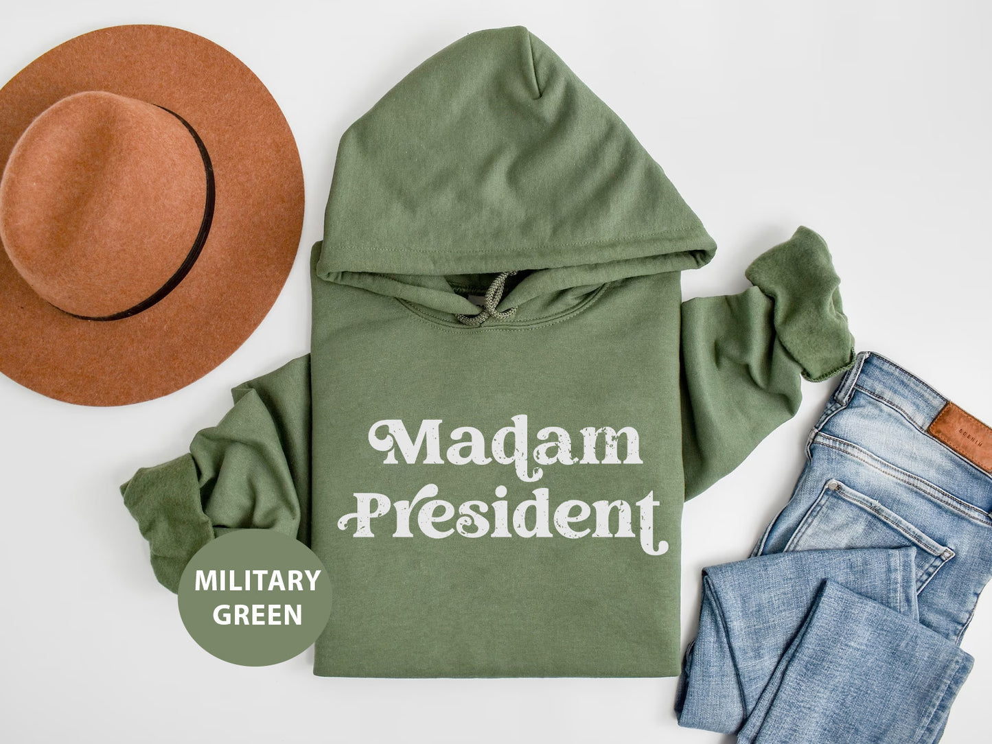 a green hoodie with the words madam president printed on it