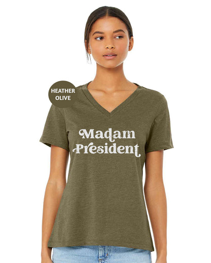 a woman wearing a t - shirt that says madam president