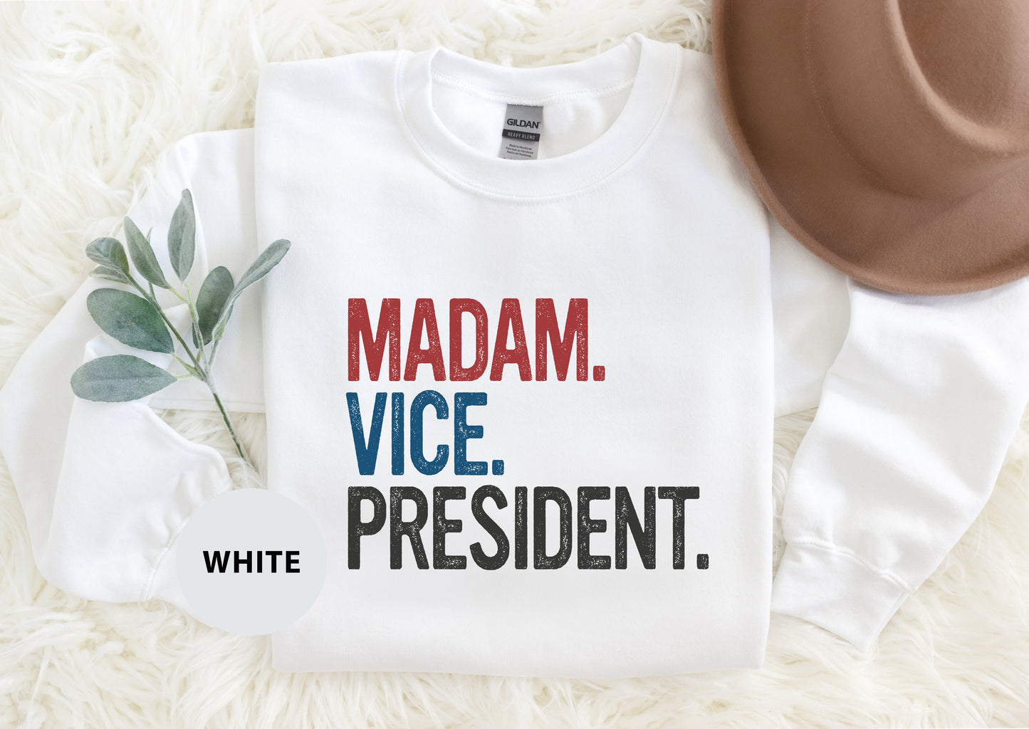 a t - shirt that says madam vice, president and a hat