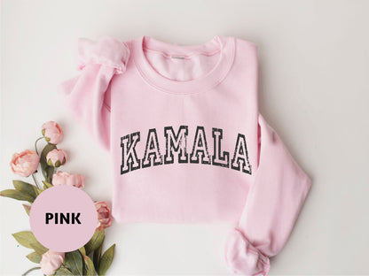 a pink sweater with the word pink printed on it