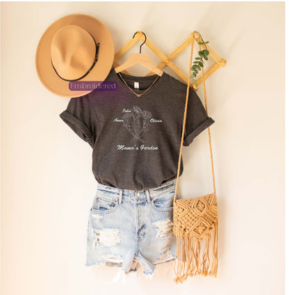 a t - shirt, hat, and purse hanging on a wall