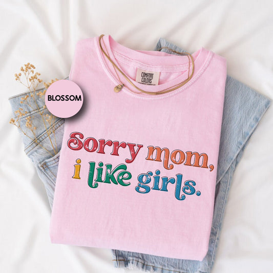 a pink shirt that says sorry mom, i like girls