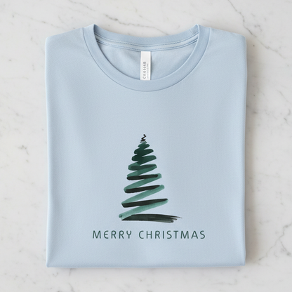 A light blue t-shirt with a Christmas tree design and the text "MERRY CHRISTMAS" printed on it.