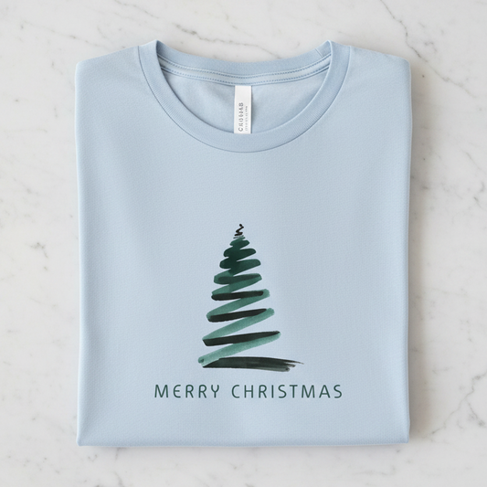 A light blue t-shirt with a Christmas tree design and the text "MERRY CHRISTMAS" printed on it.