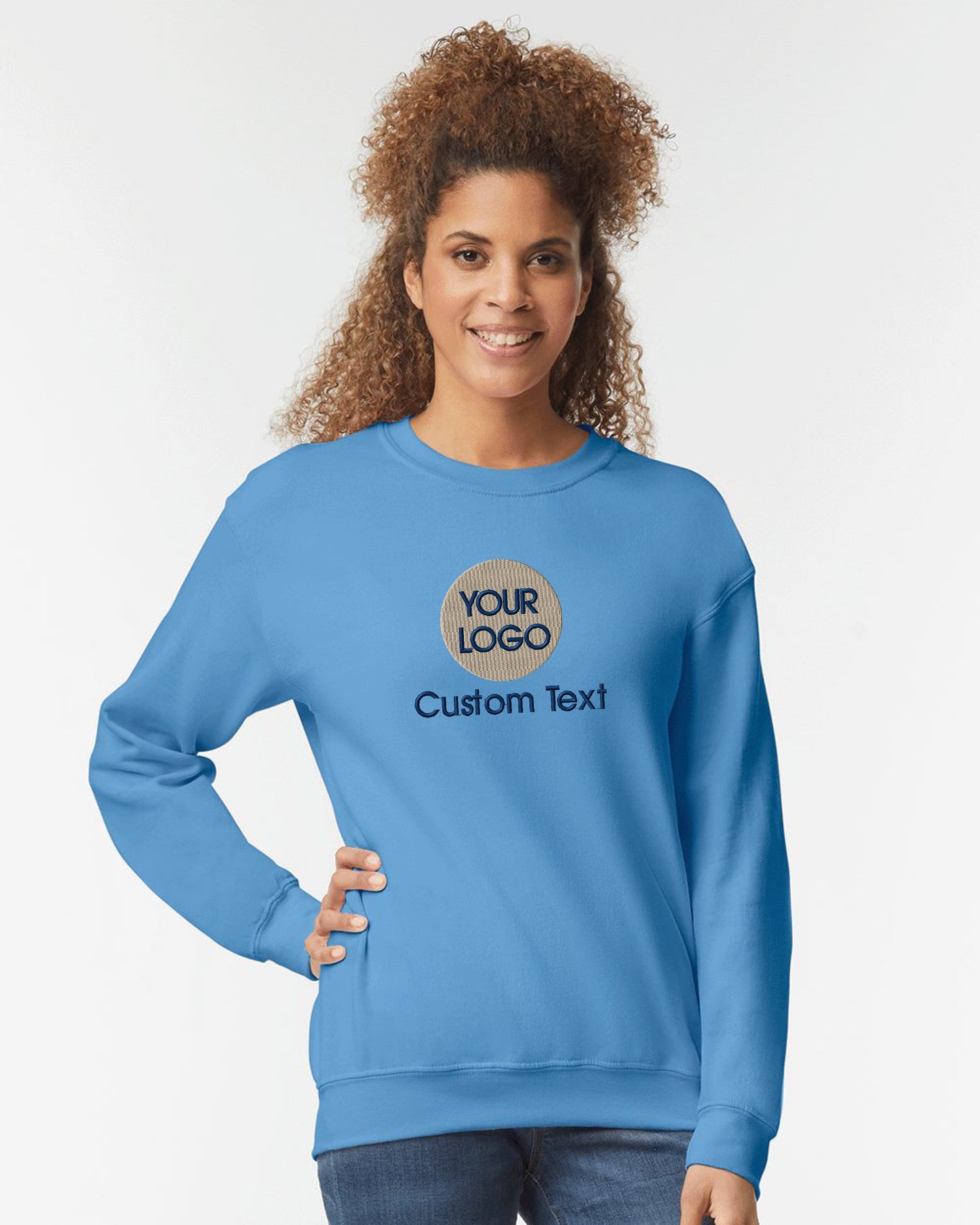 a woman wearing a blue sweatshirt that says your logo is custom text