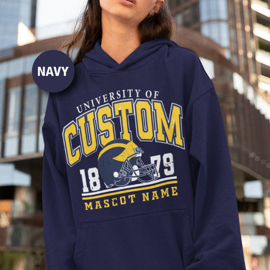 a woman wearing a navy hoodie with a football helmet on it