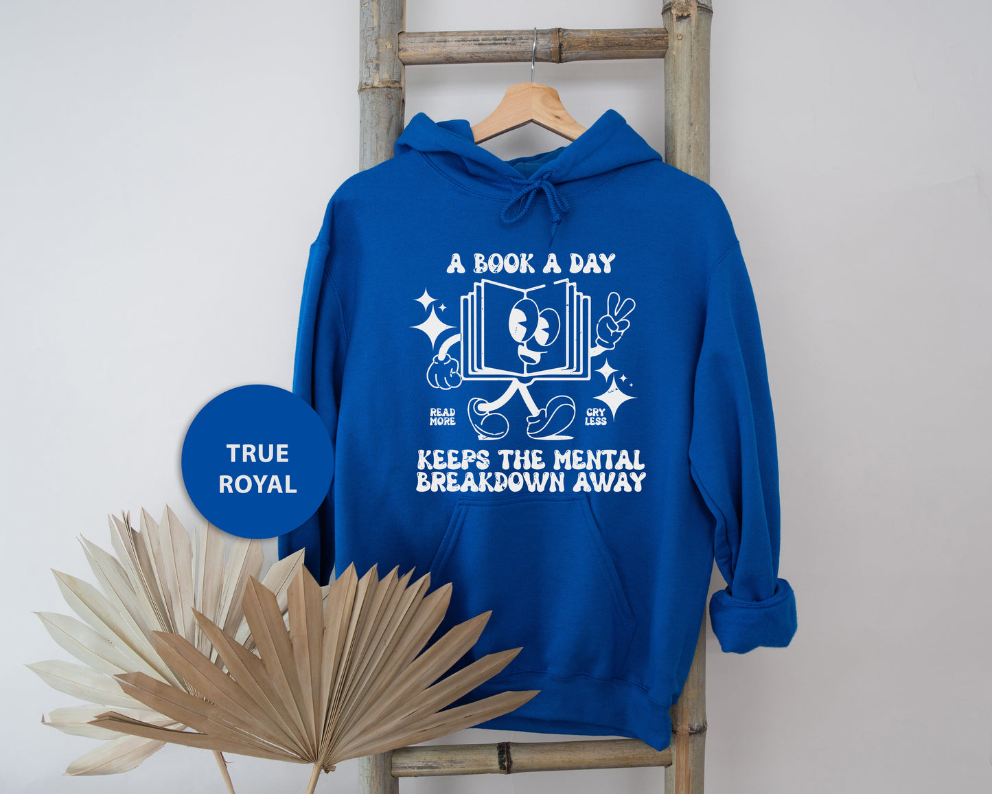 a blue hoodie with a book a day on it