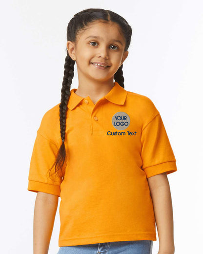 a young girl wearing an orange polo shirt