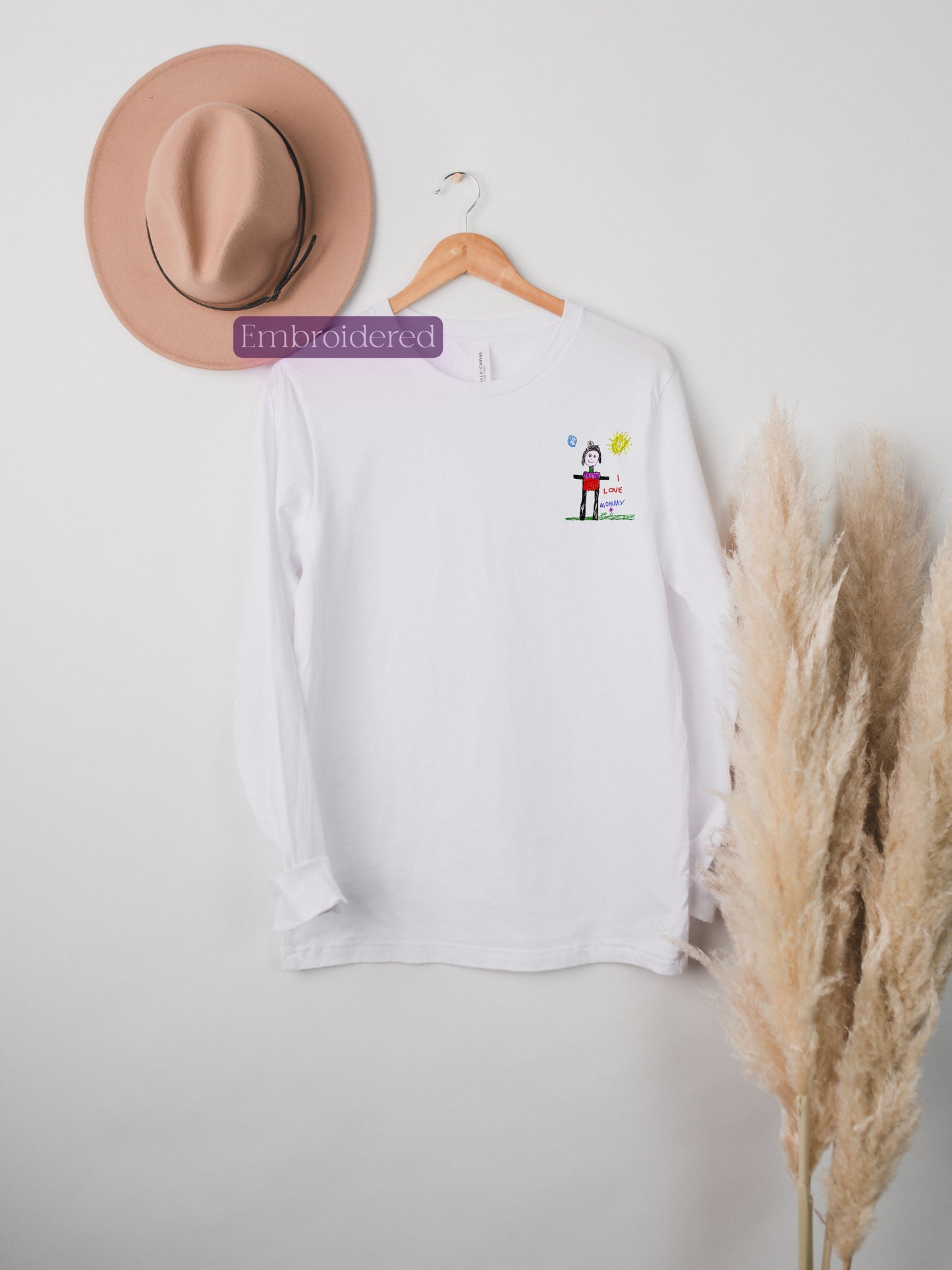 a hat and a t - shirt hanging on a wall