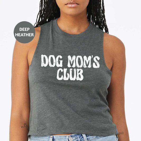 a woman wearing a dog mom's club tank top